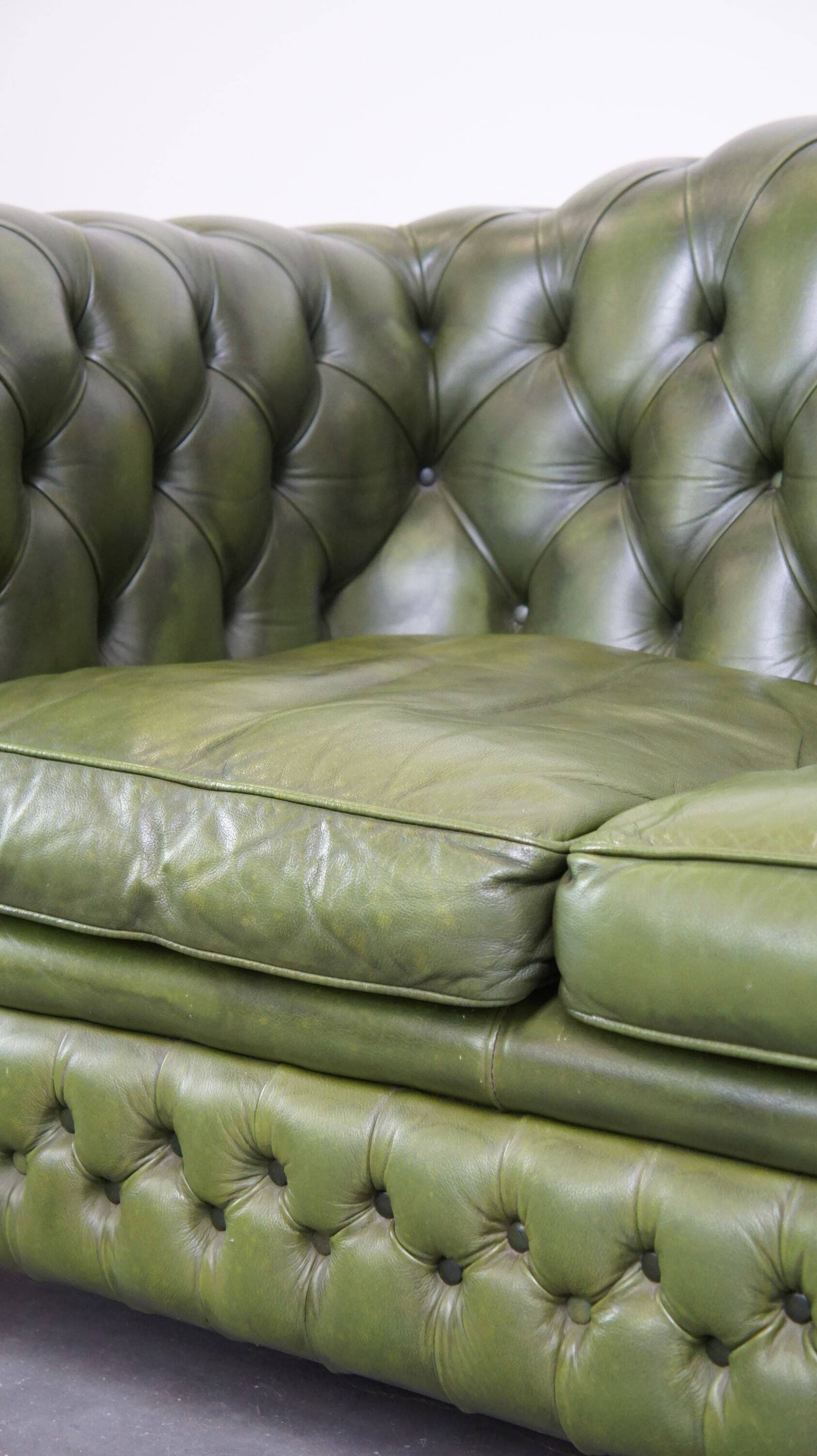 Stylish, English green cow leather spacious 2.5 seater chesterfield sofa