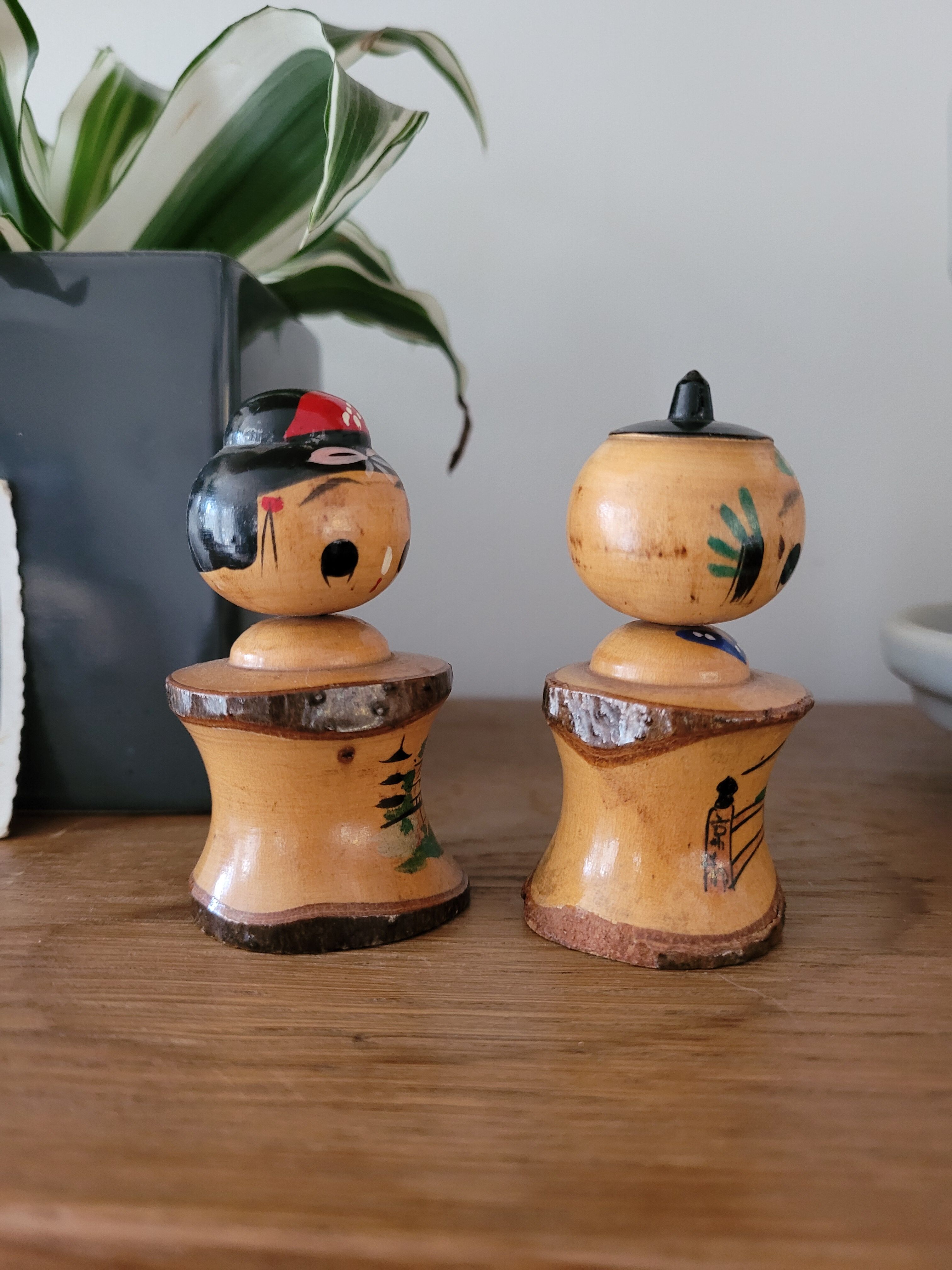 Two Kokeshi dolls