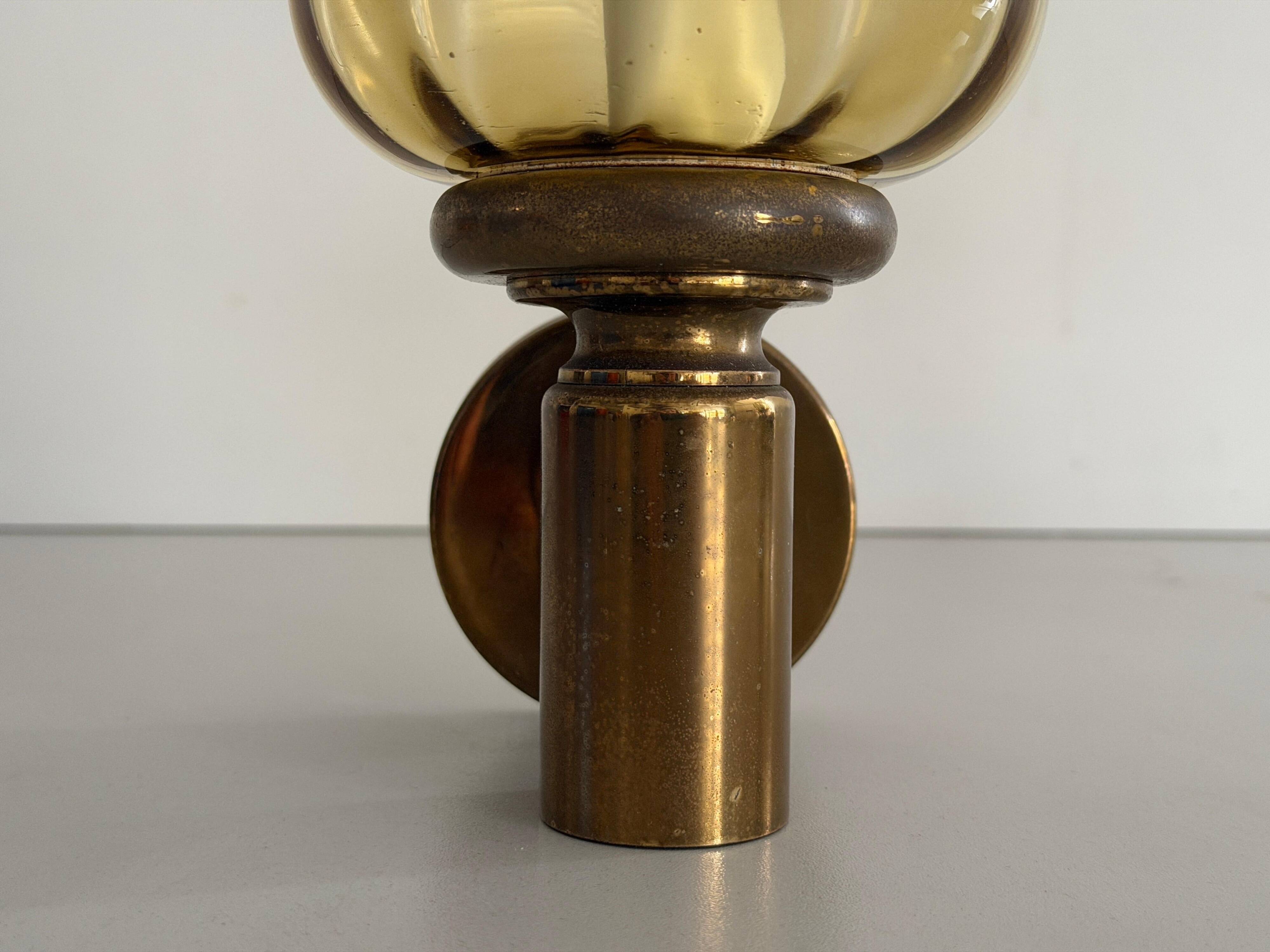 Pair of yellow glass and brass wall lights from the mid-century by N Leuchten, 1960s, Germany.