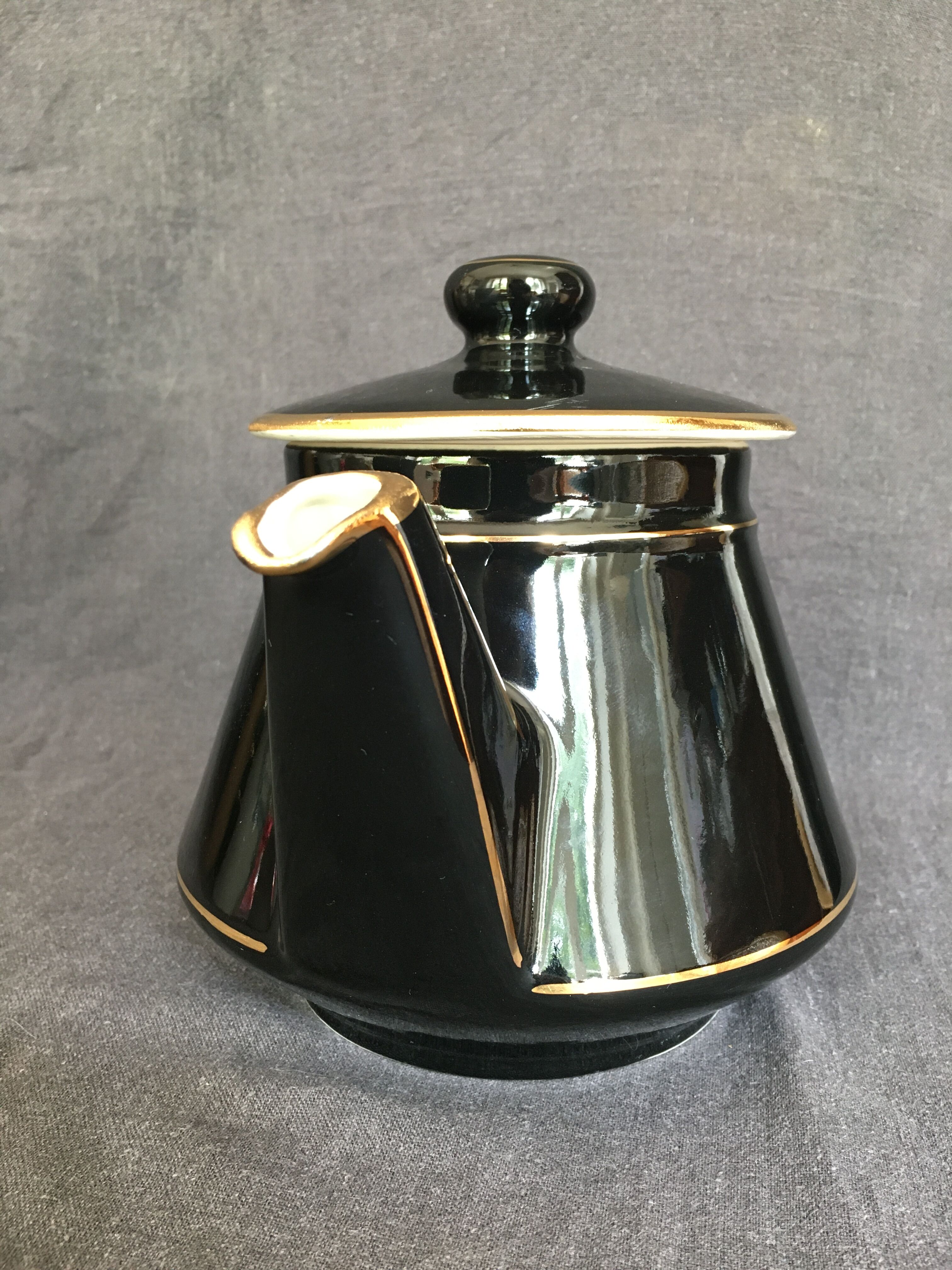 Black and gold ceramic coffee maker