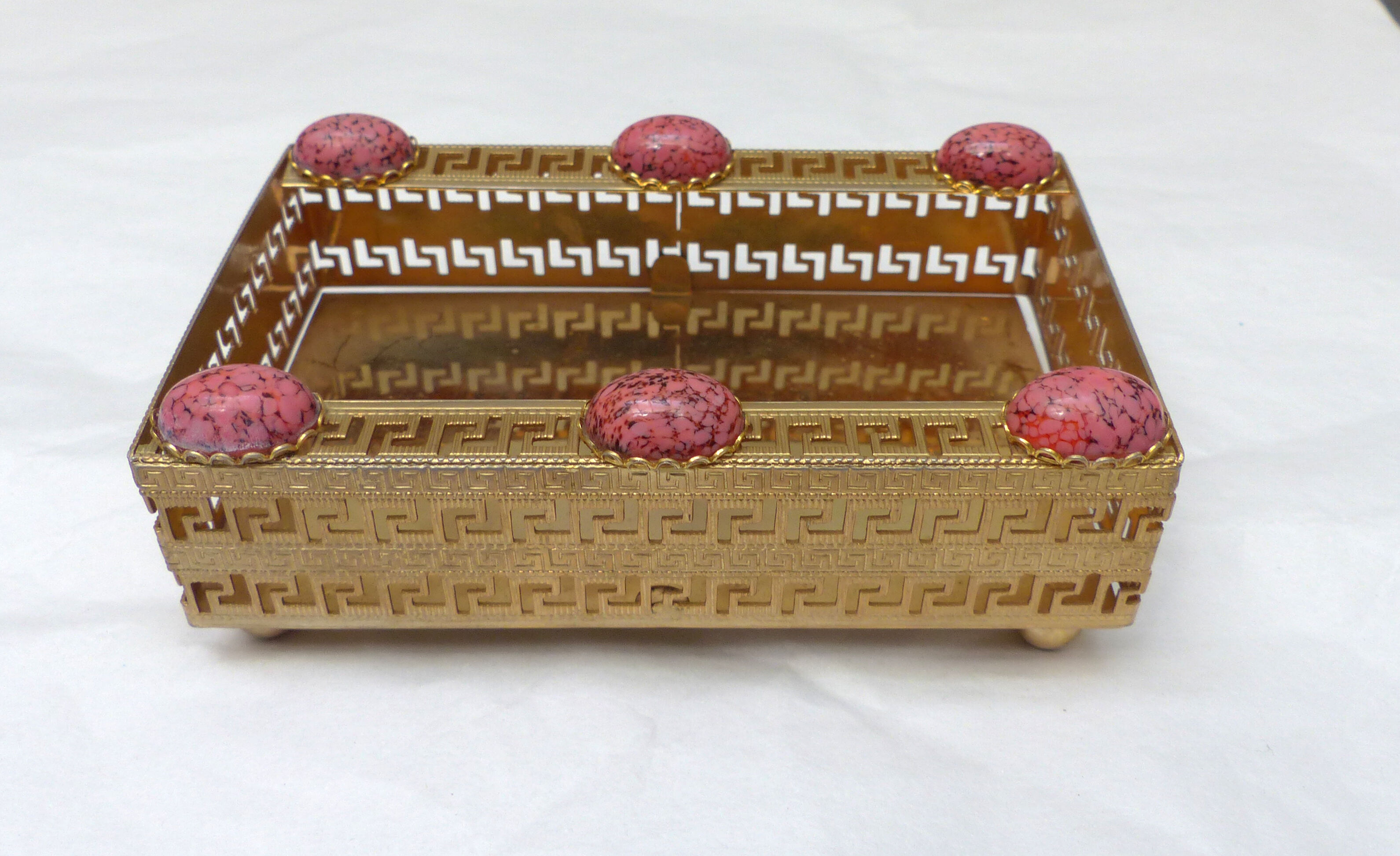 Golden metal catchall with pink stones