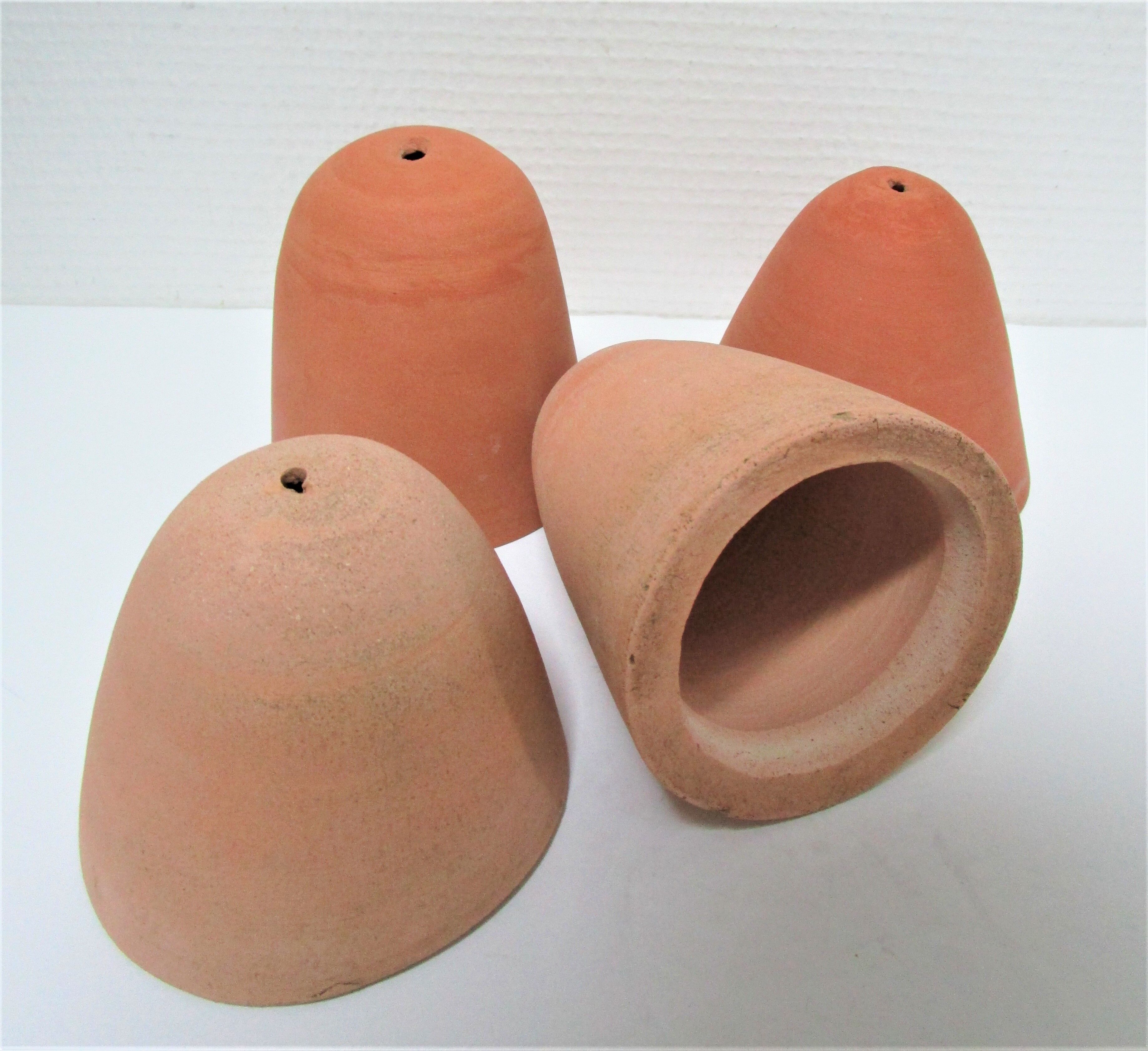 Four bells for seedlings in vintage terracotta