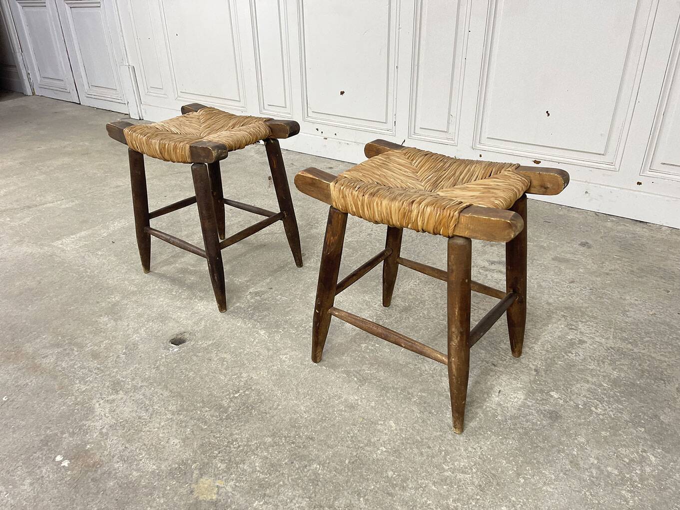 A pair of 1950s straw stools.