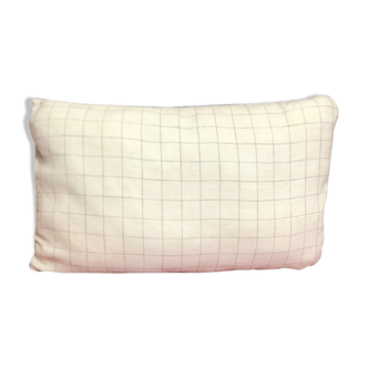 Beige linen cushion with checkered pattern and shiny dark gray piping