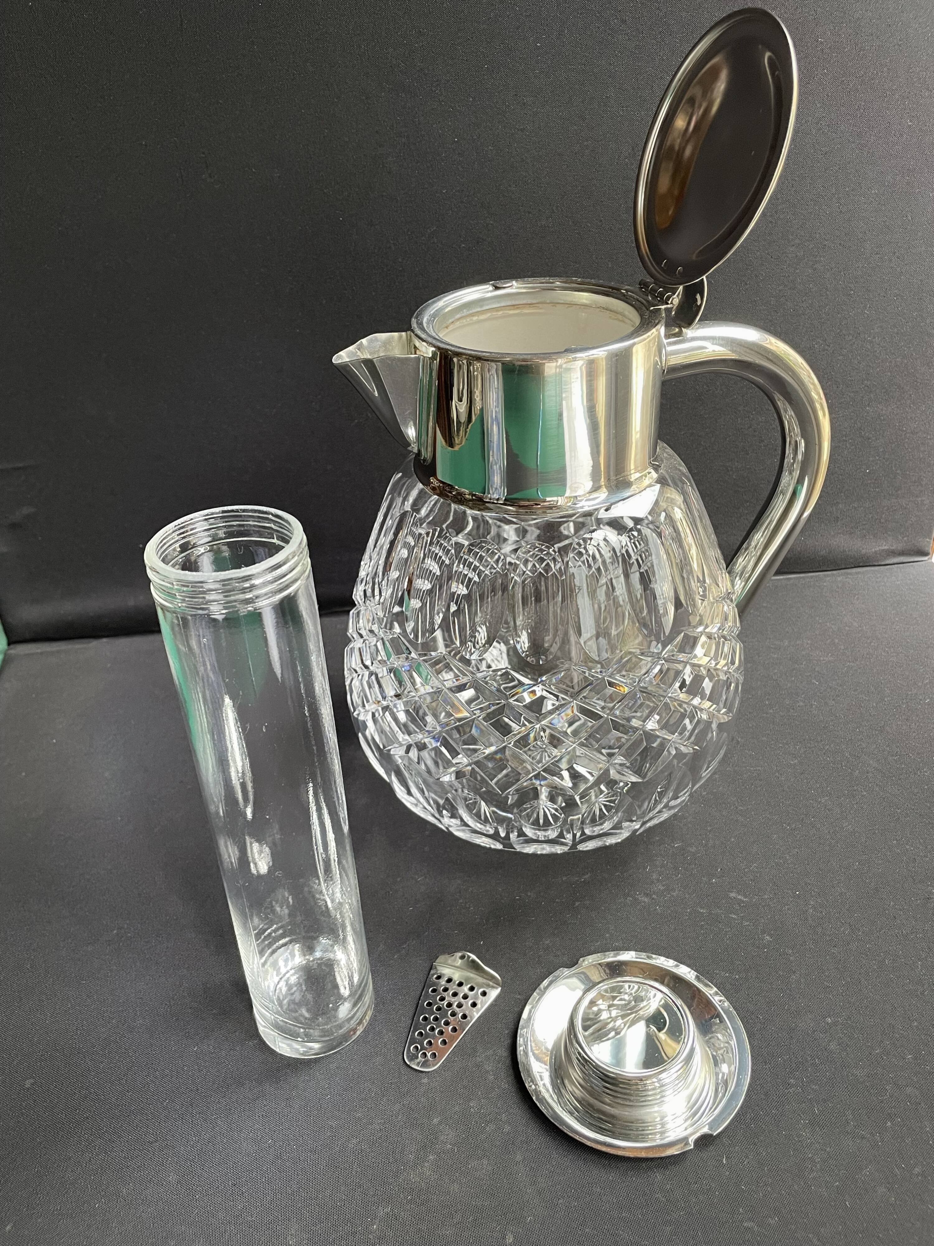 Important jug with ice reserve in cut crystal and silver-plated metal