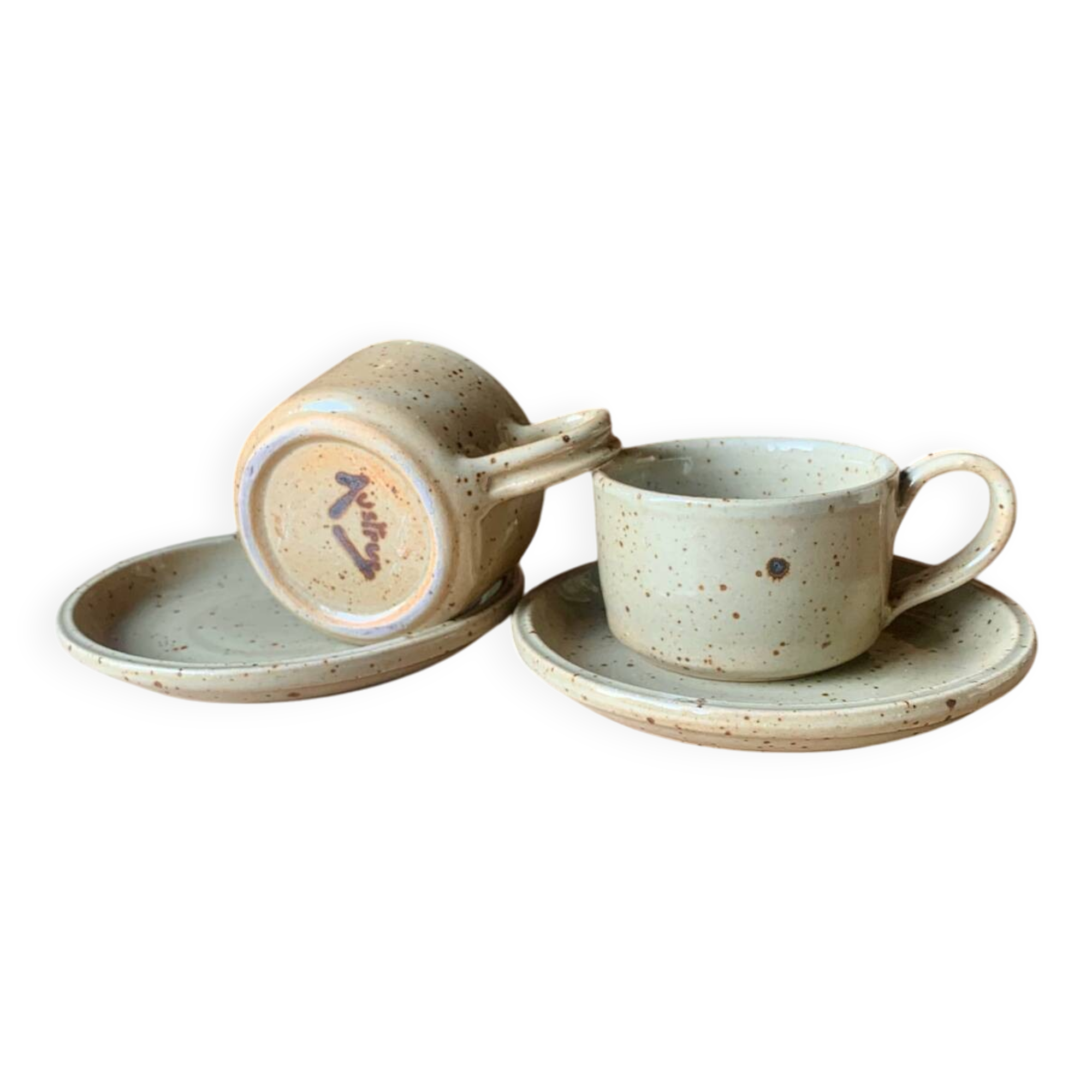 Two large Jean Austruy stoneware cups and saucers