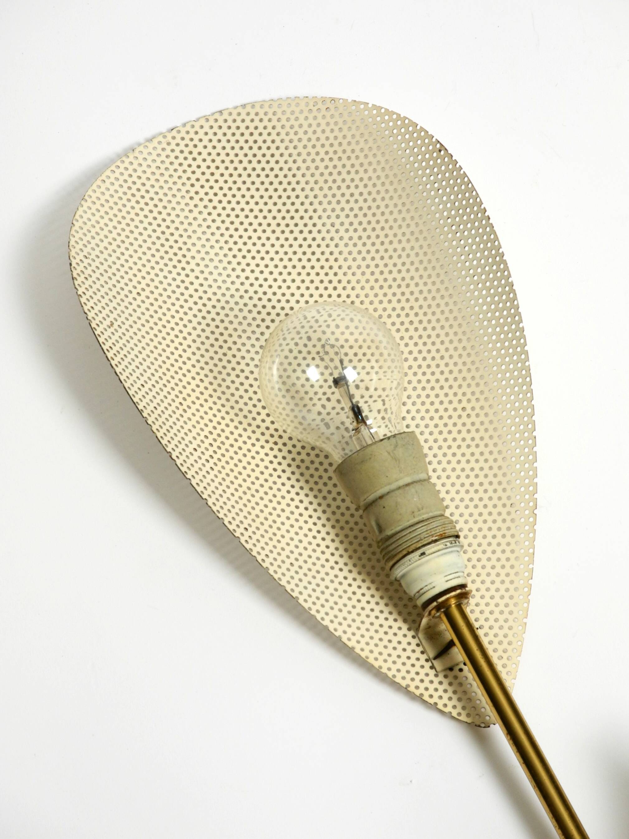 Mid Century Modern brass wall lamp with perforated metal sheet lampshades