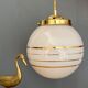 Suspension globe vintage art déco en opaline blanche et dorée
