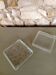 Set of two glass ashtrays.