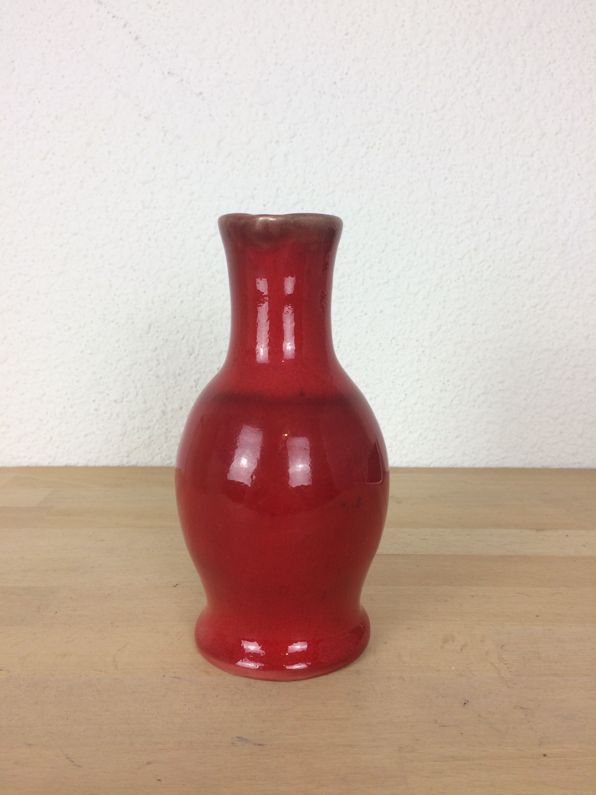 Red ceramic pitcher