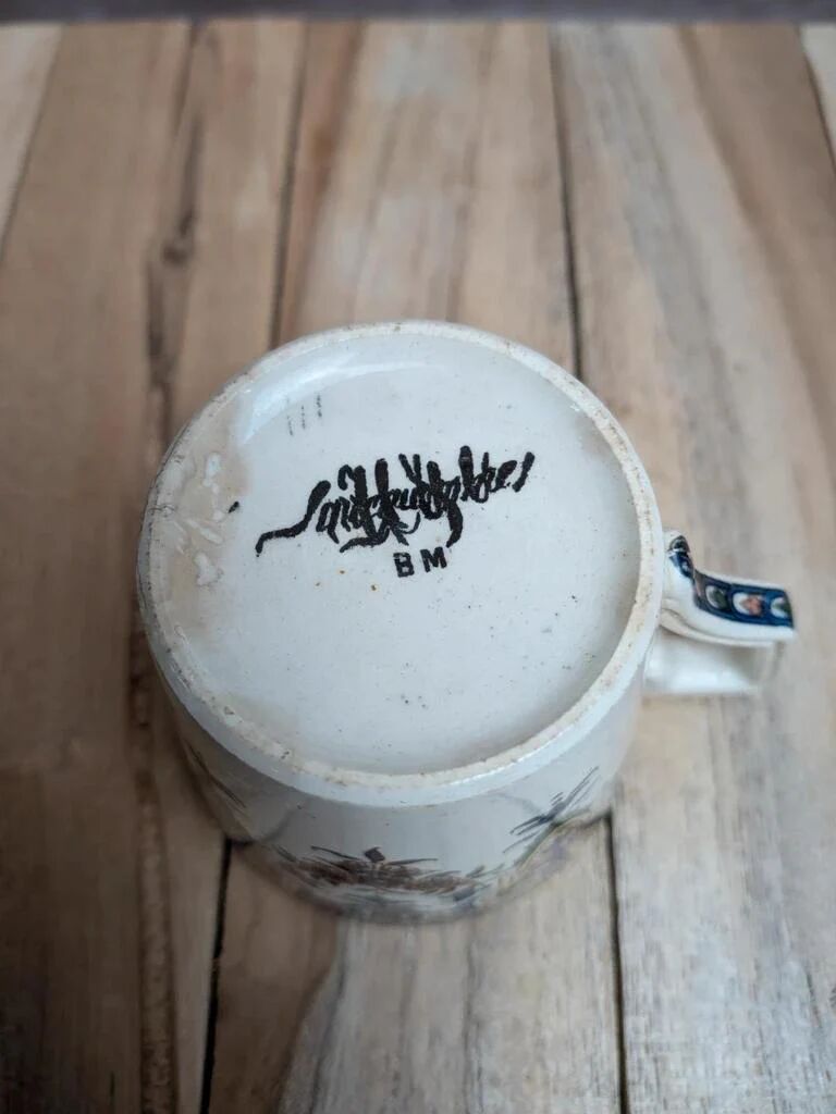 Antique ironstone cup from Sarreguemines with polychrome decoration.