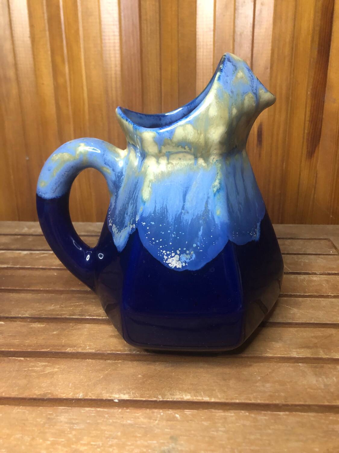 Old vintage blue ceramic pitcher