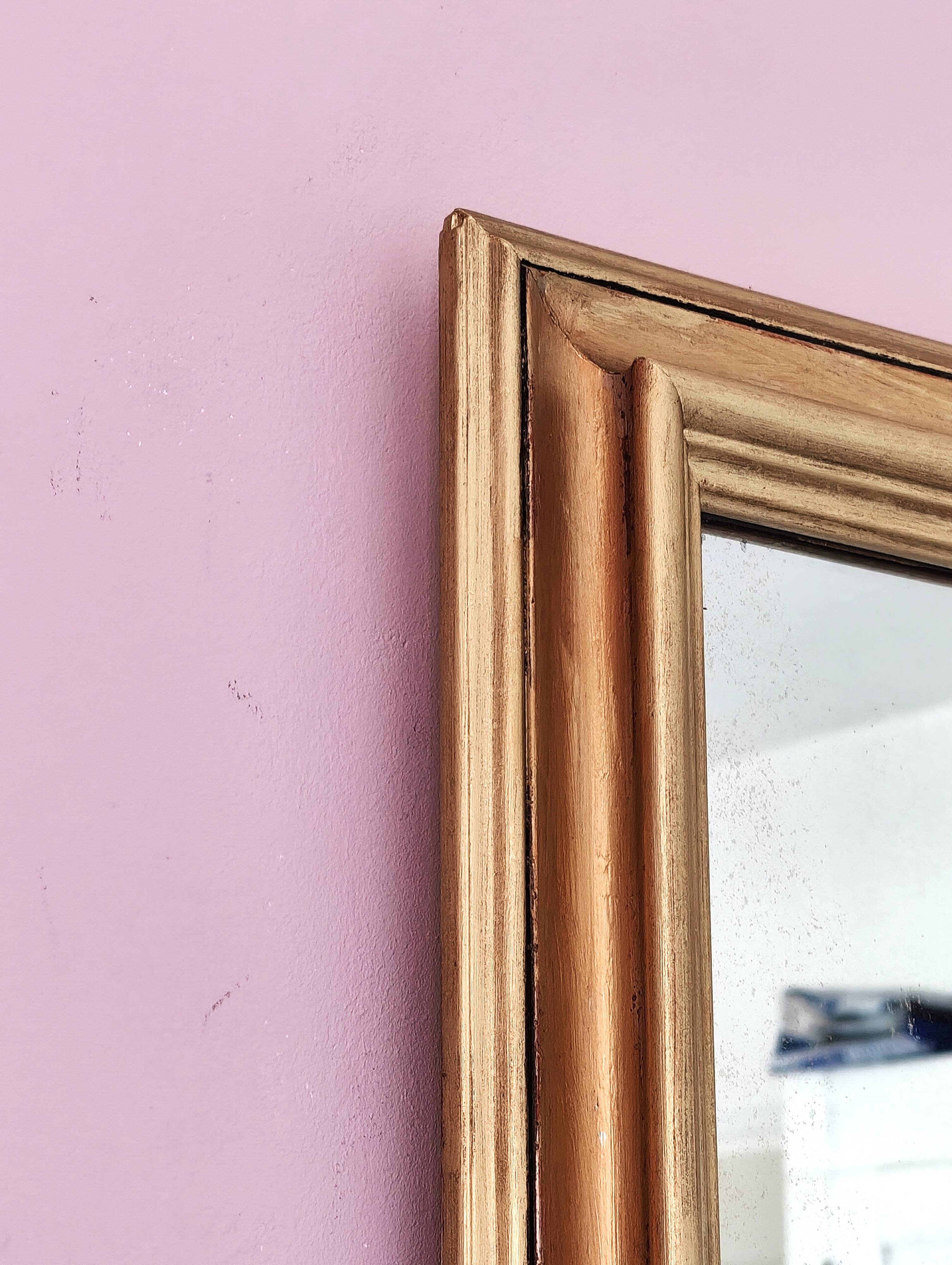 Miroir ancien en bois doré et cuivré