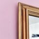 Miroir ancien en bois doré et cuivré