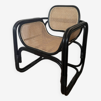 Black cane and natural rattan armchair