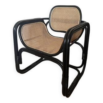 Black cane and natural rattan armchair