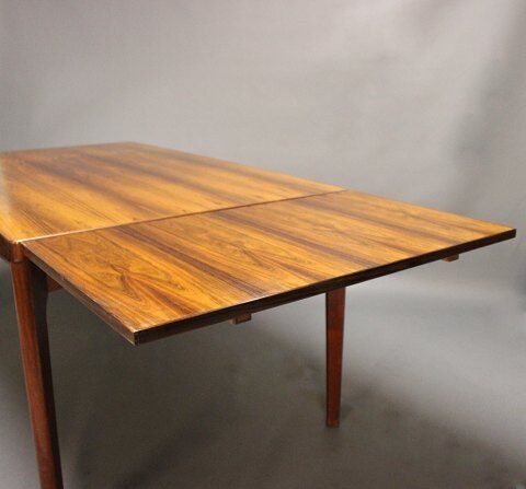 Teak dining table designed by Henning Kjaernulf and manufactured 60 years