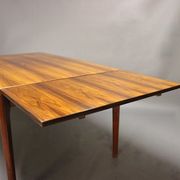 Teak dining table designed by Henning Kjaernulf and manufactured 60 years