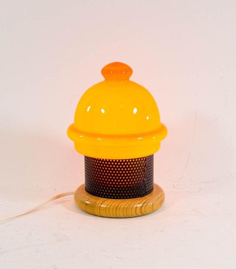 Vintage table lamp in orange glass and black perforated metal 70s