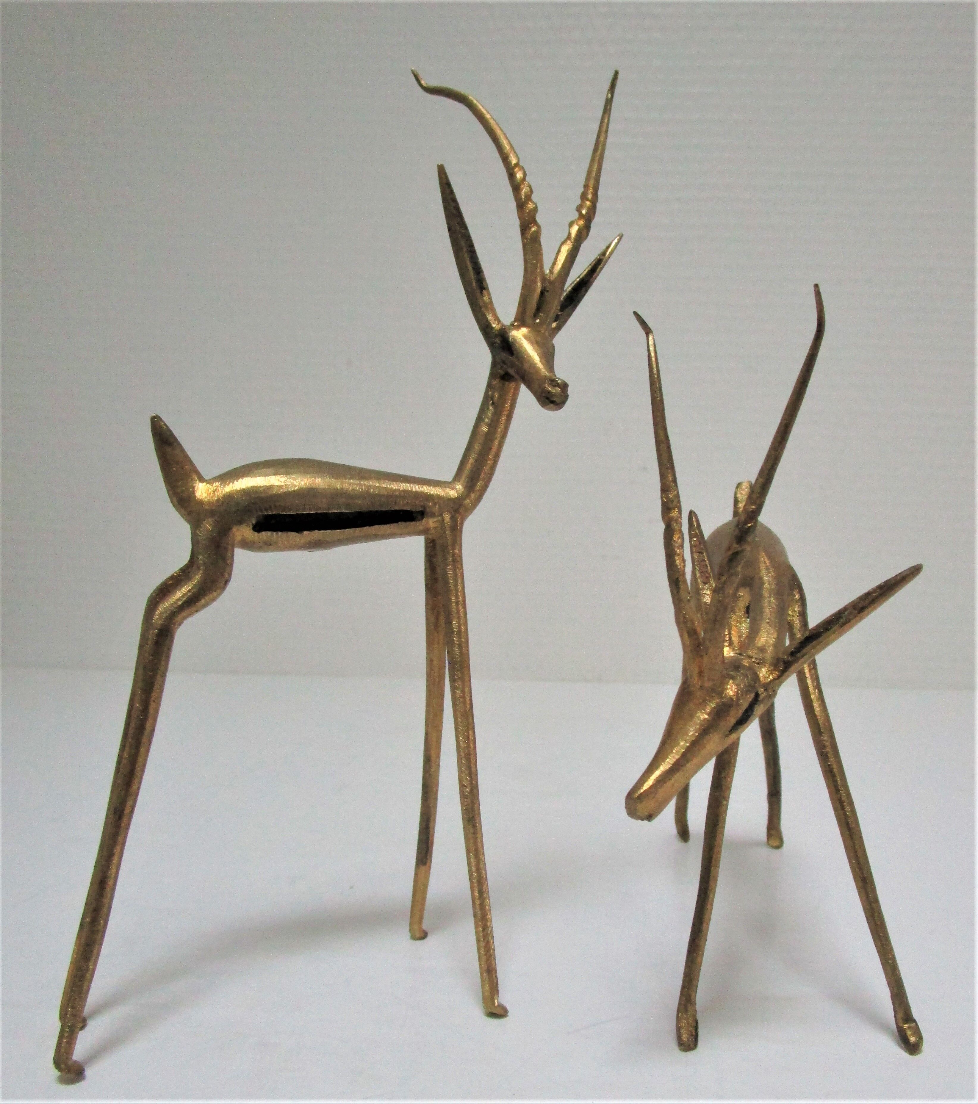 Four vintage brass antelope gazelles