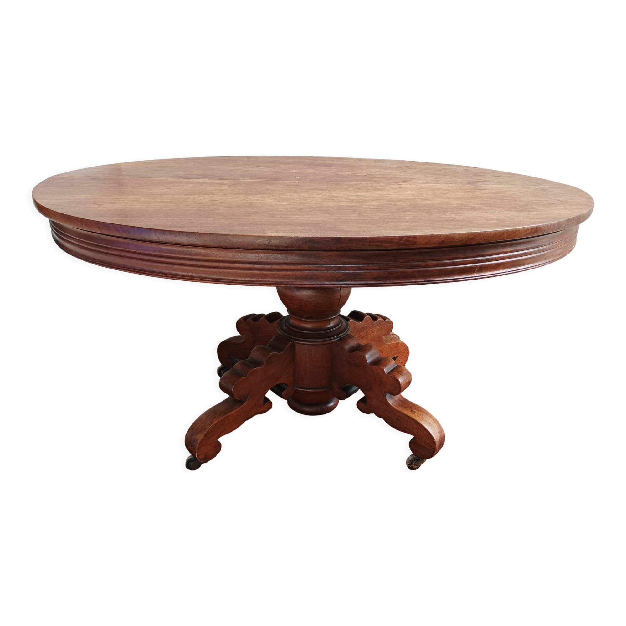English oval table with 19th century mahogany extensions
