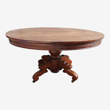 English oval table with 19th century mahogany extensions