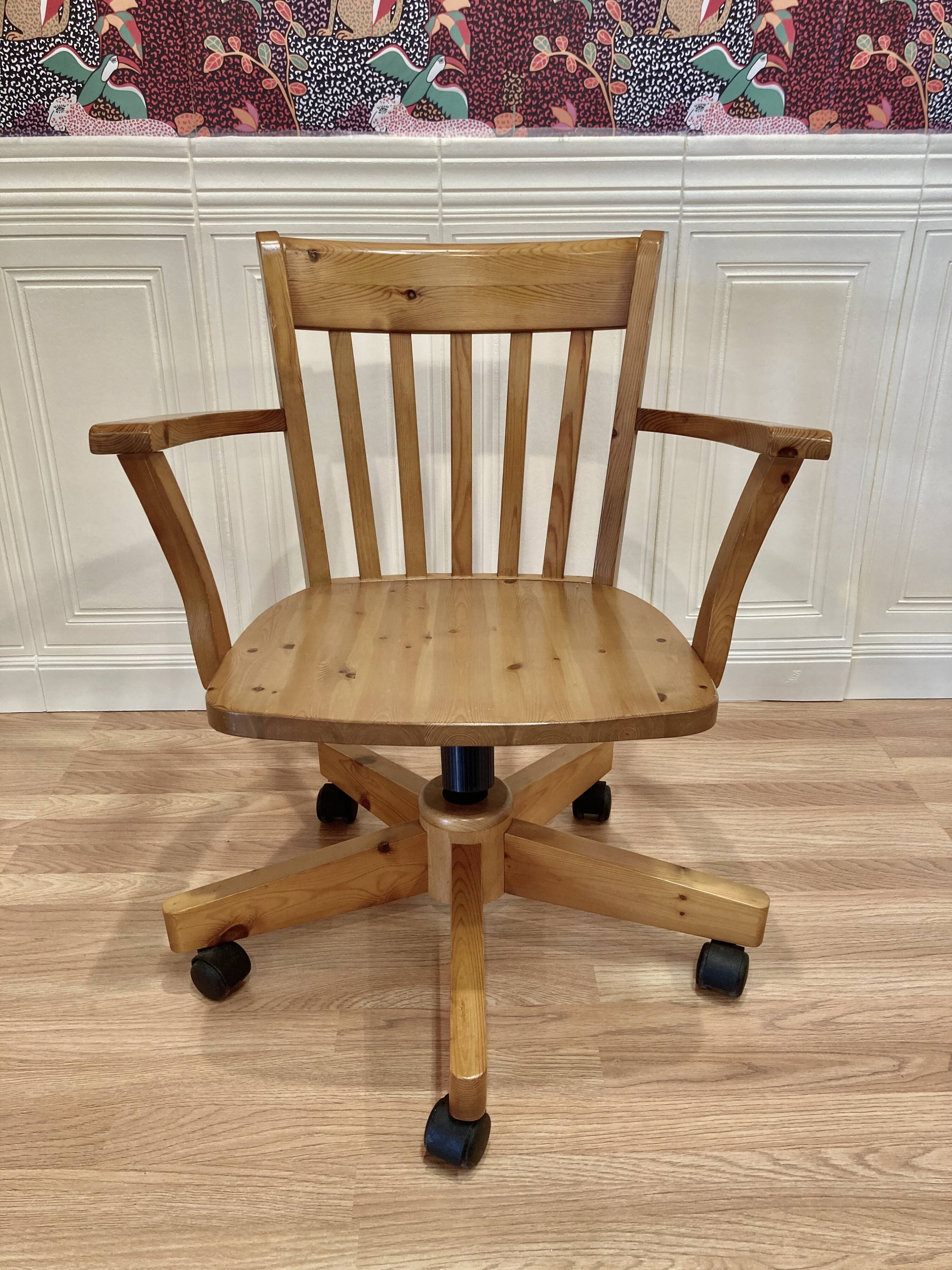 Solid wood swivel and reclining armchair.