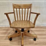 Solid wood swivel and reclining armchair.