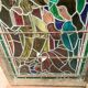 Stained glass panel representing a nineteenth century coronation