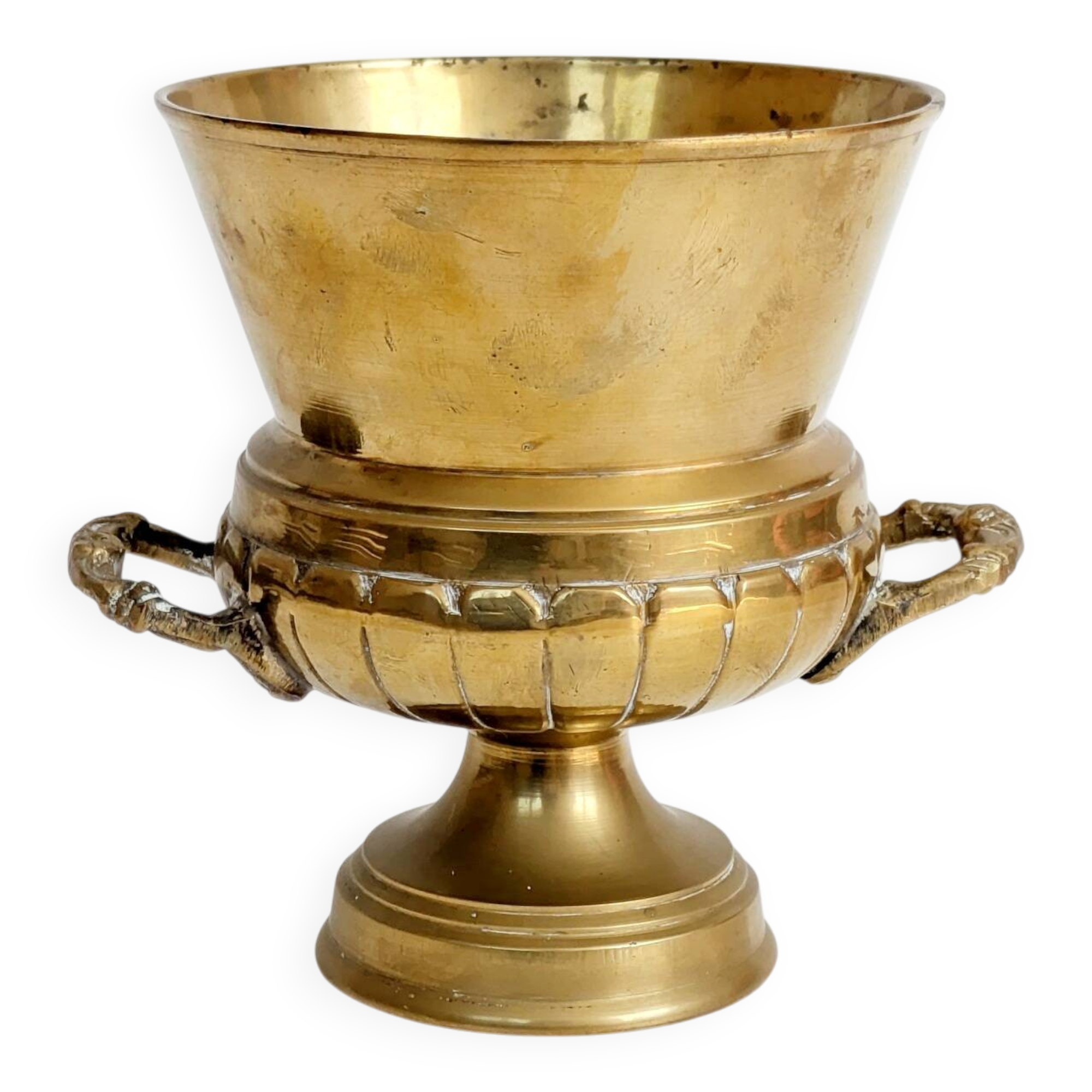 Vintage brass cache-pot on a stand with handles, classic decor.