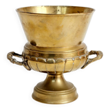 Vintage brass cache-pot on a stand with handles, classic decor.