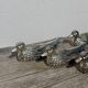 12 silver metal duck knife rests