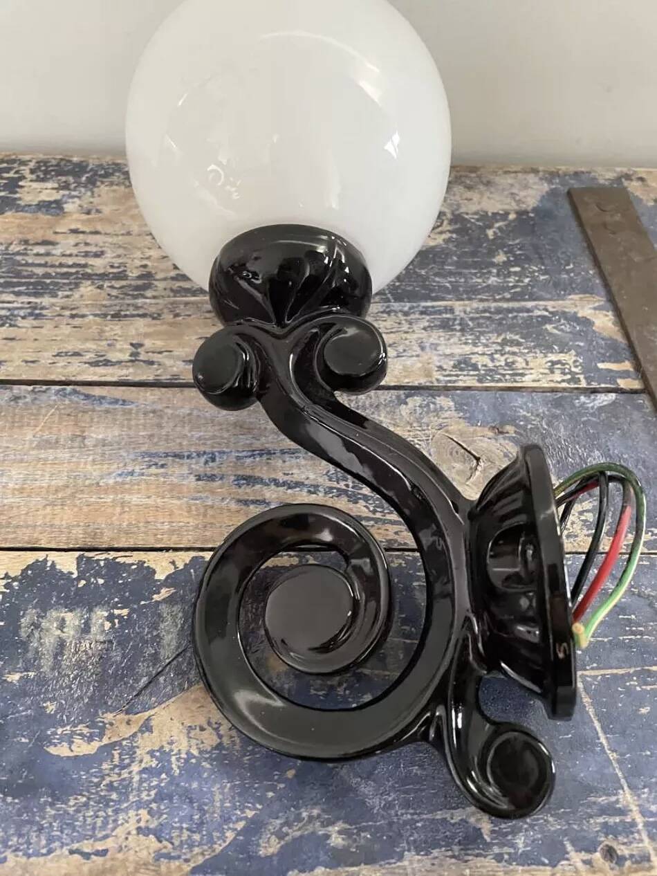 Pair of vintage enameled cast iron wall sconces