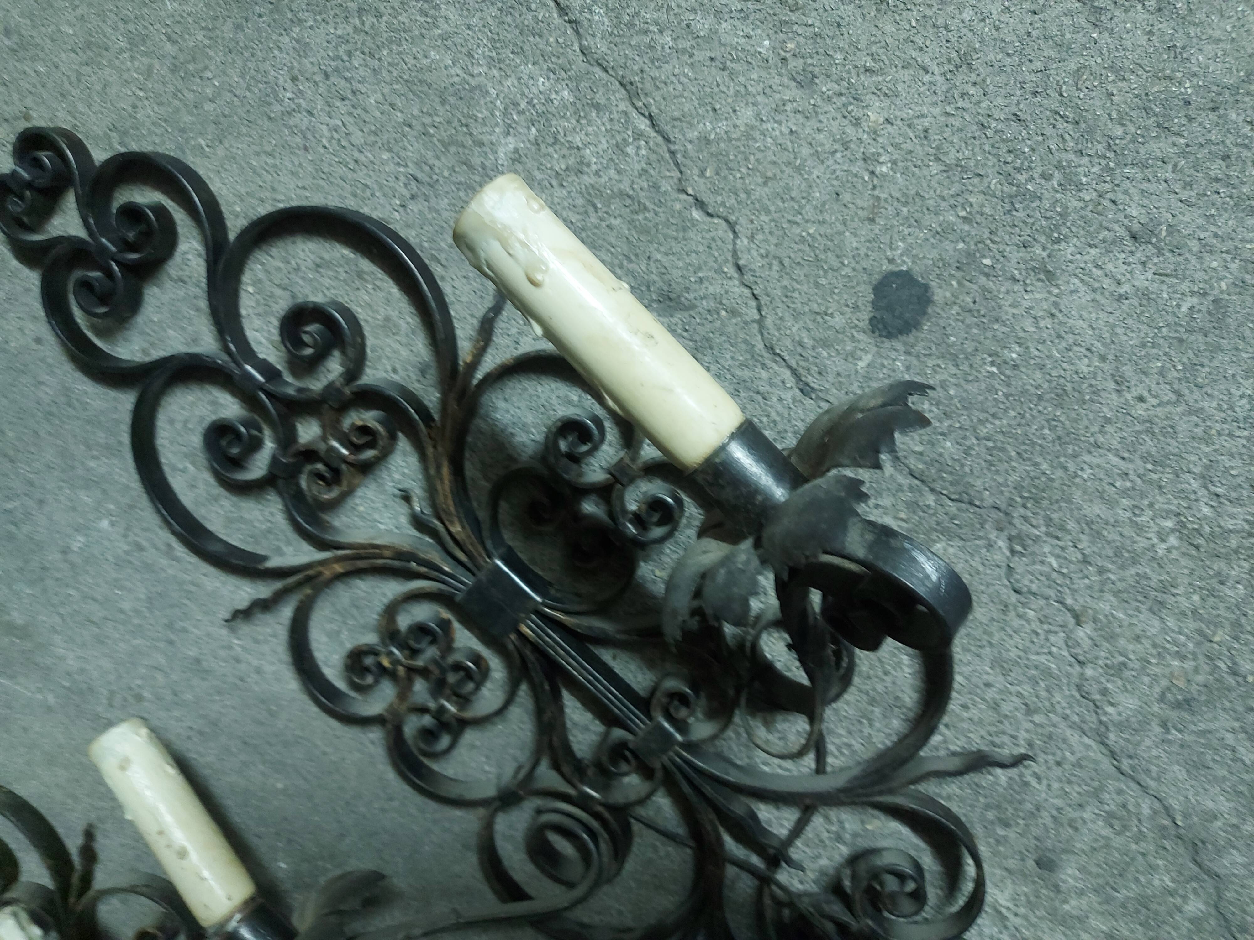 Two large wrought iron wall lights