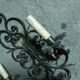 Two large wrought iron wall lights
