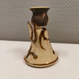 Ceramic candle holder, in the shape of an angel, signed at the bottom.