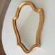 Vintage baroque mirror in gilded wood in the Louis XV style.