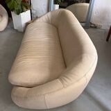 Rounded off-white leather sofa