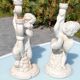 Pair of "cherub" candle holders in plaster