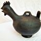 Pourer, terracotta teapot. Hen.