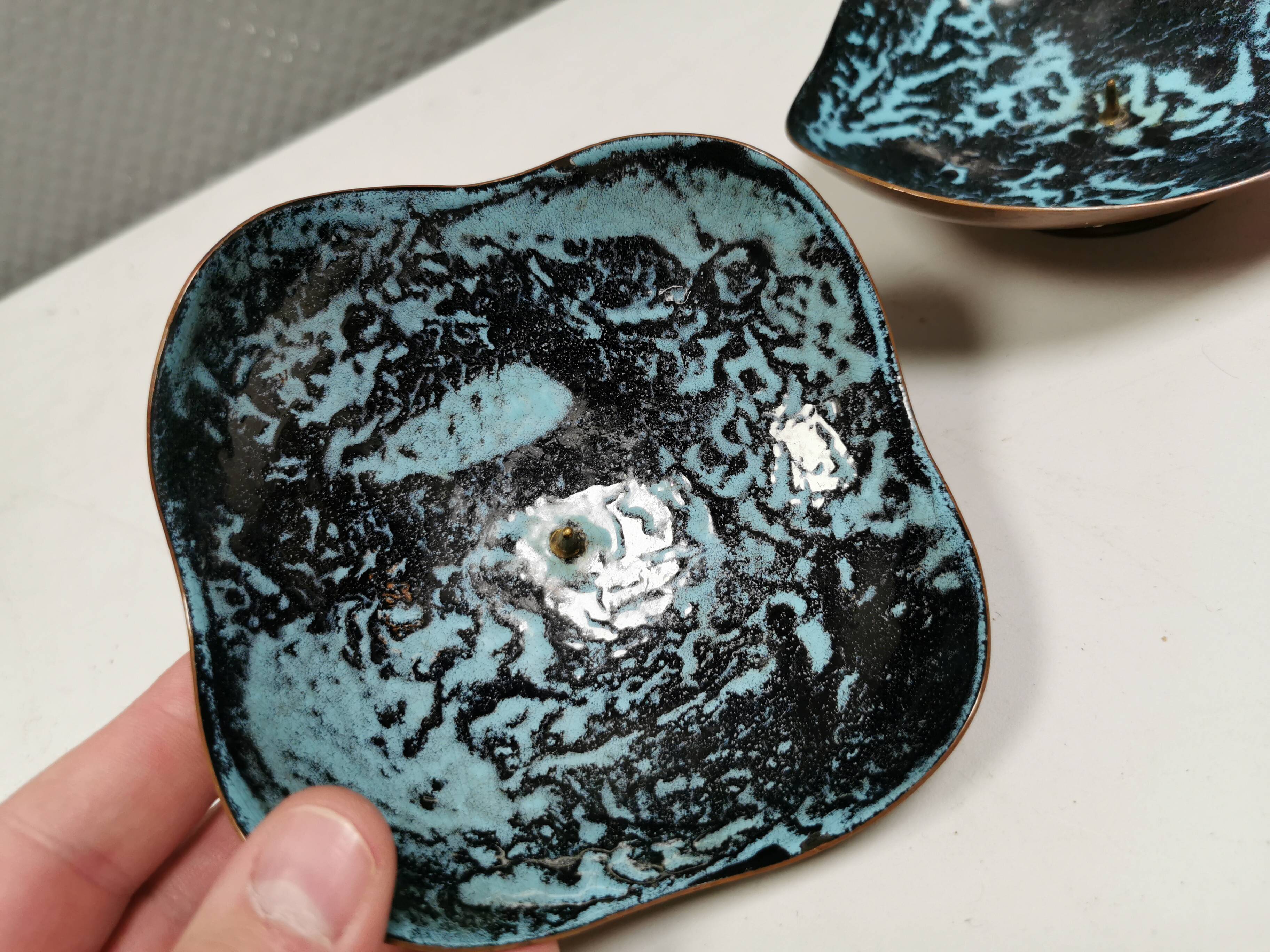 Set of candlesticks. Made of copper and blue/black enamel. From Danish Meka (1951 - 1989)