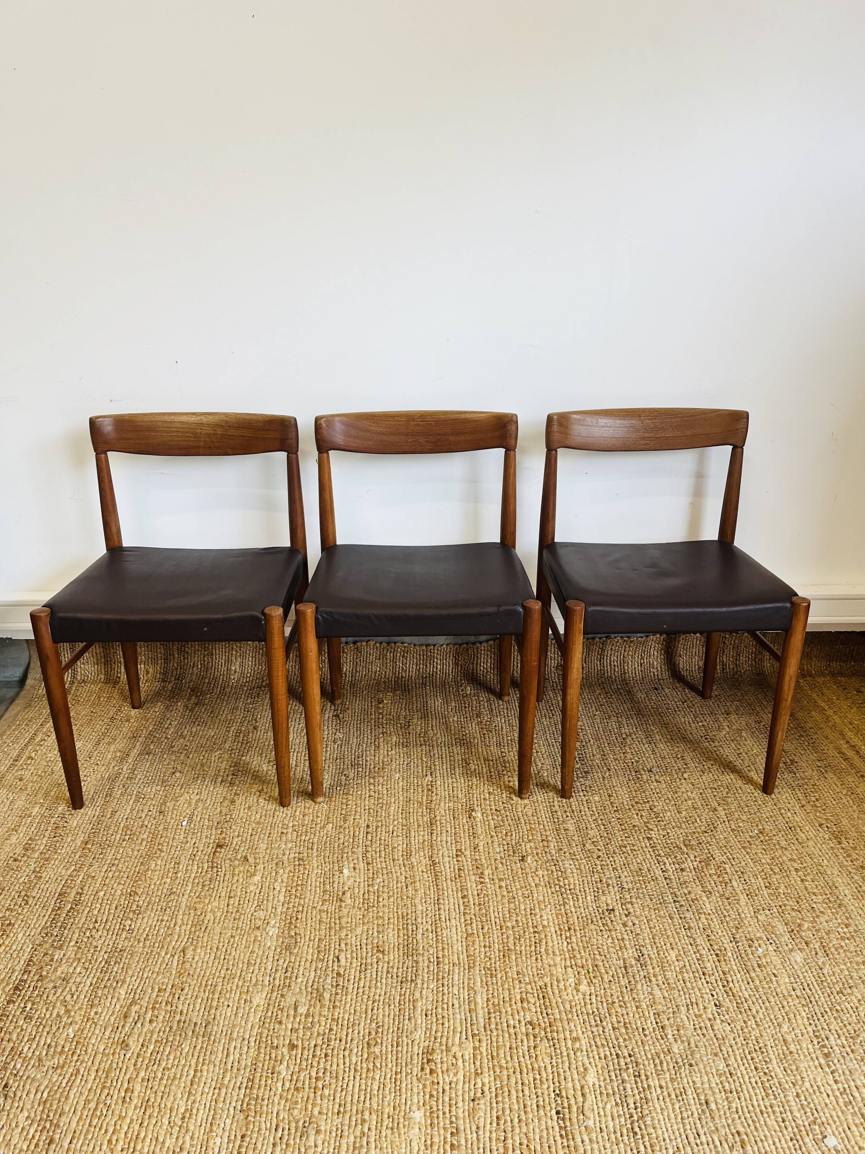3 vintage Scandinavian chairs in teak and brown leatherette