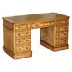 Antique desk by James Winter & Sons London in satin wood and leather.