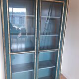Glass cabinet in green patinated wood