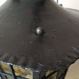 Large hanging lantern in wrought iron and opaque yellow-orange windows