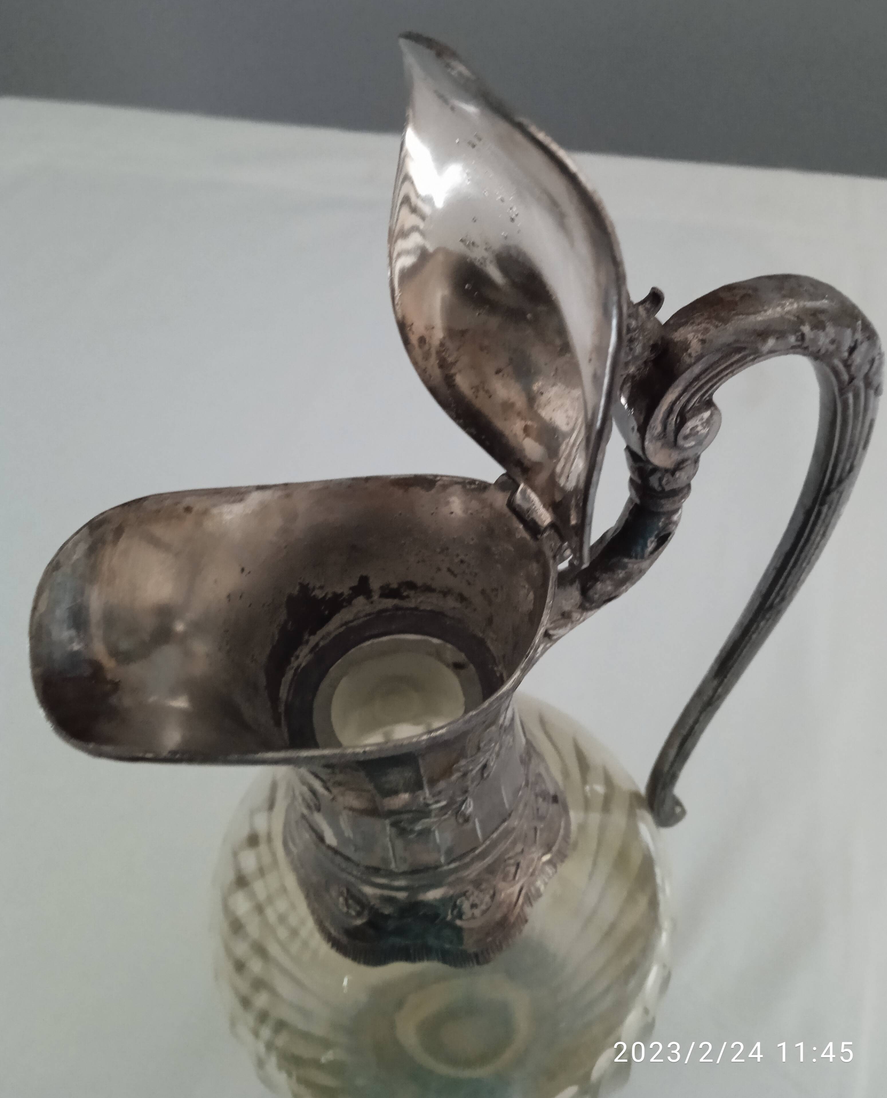 Glass and silver metal ewer