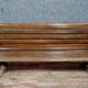 Park bench and garden with natural wood backrest xixth century