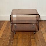 Smoked Plexiglas coffee table on wheels -
