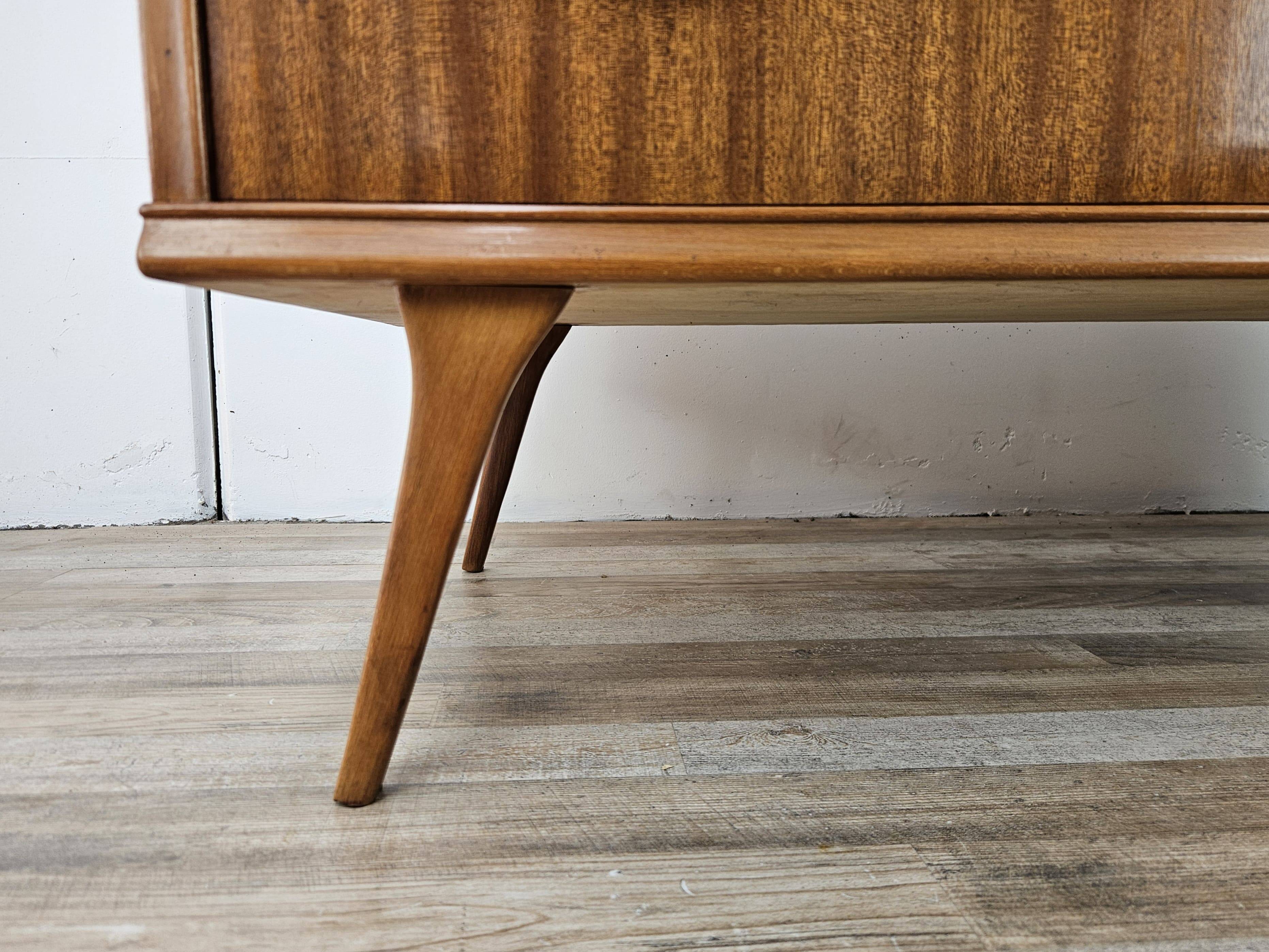 1950s chest of drawers covered in walnut with brass handles