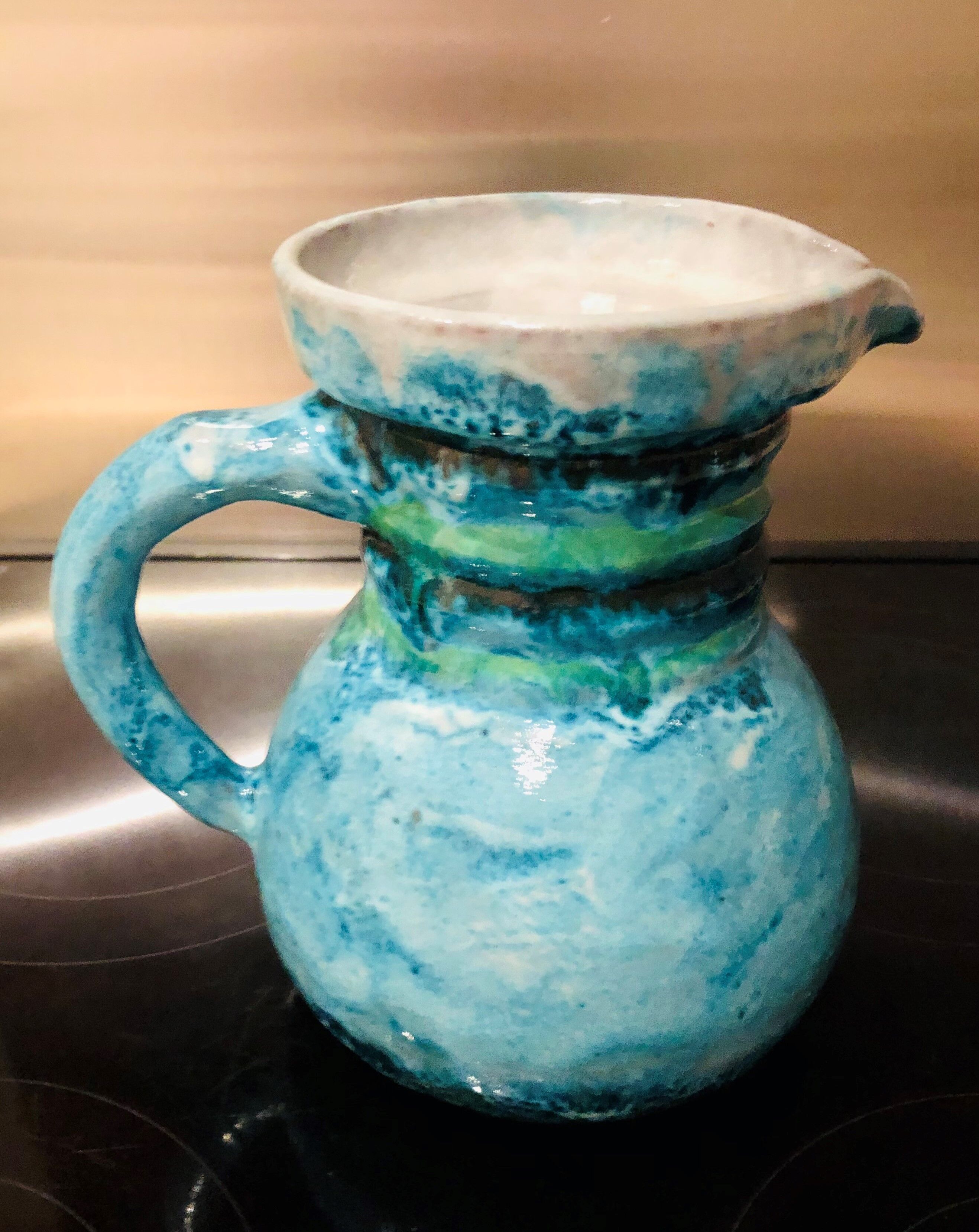 Old pitcher in terracotta signed